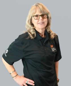 Tracy Rutter wearing a black polo shirt
