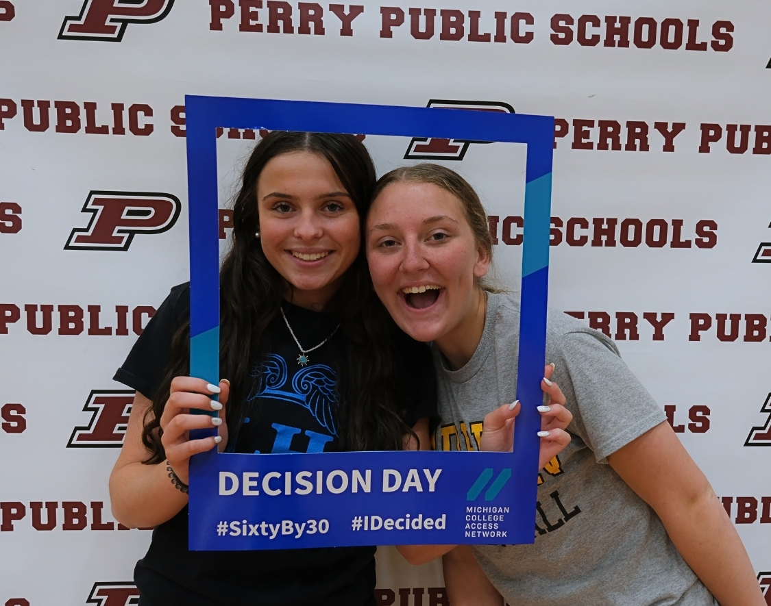 Two high school students in a Decision Day frame