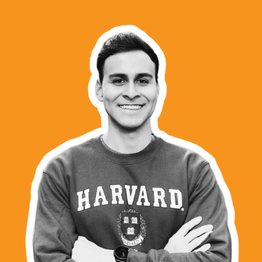 Ezequiel Jimenez's headshot. He is wearing a Harvard shirt with the school's logo.